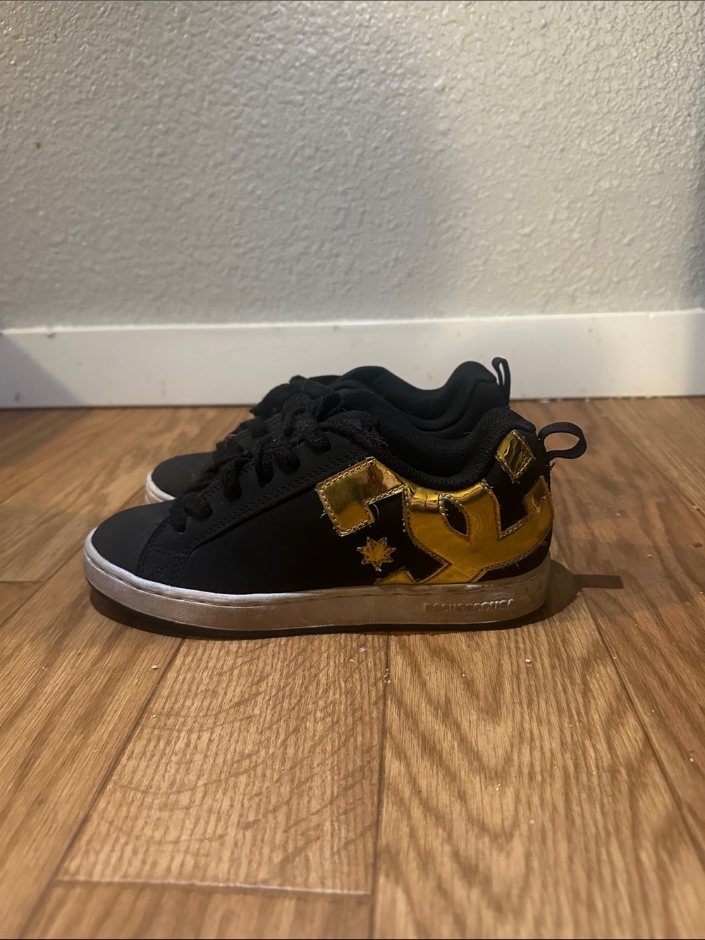 DC Women Black Sneakers with Gold Accent